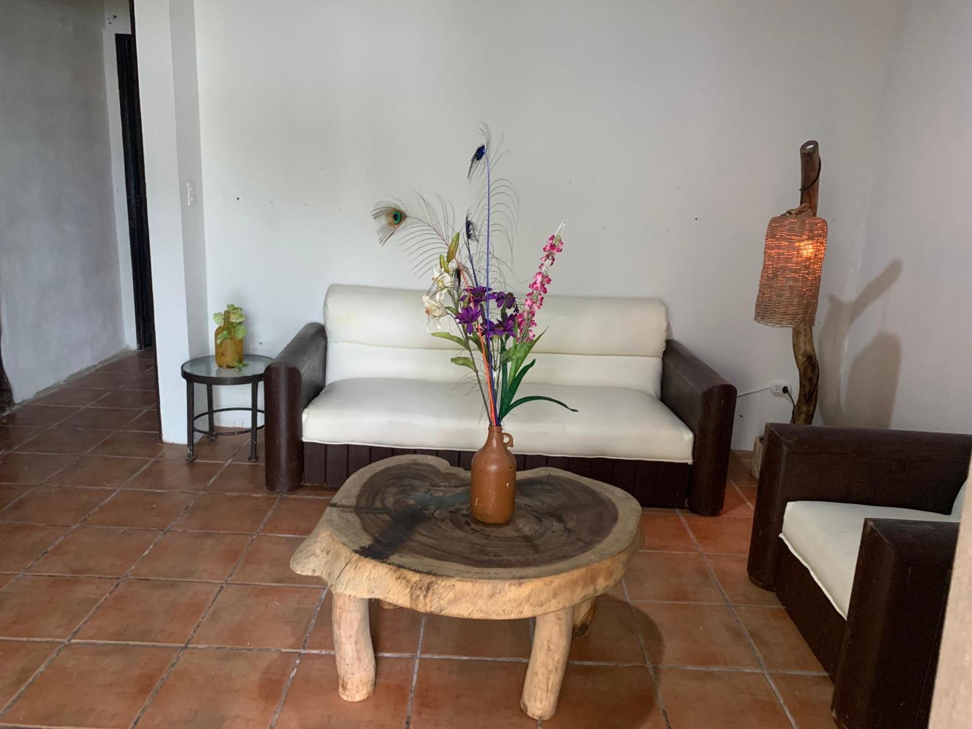 Casa Caribe Cancún Kültér fotó A living room in a typical house in the community